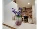 Kitchen with brick accent wall and modern range at 1441 E 84Th Pl, Denver, CO 80229