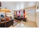 Living room with leather sofas and patterned rug at 1441 E 84Th Pl, Denver, CO 80229