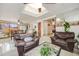 Open concept living room and dining area with skylights at 1441 E 84Th Pl, Denver, CO 80229