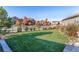 Expansive backyard with a well-manicured lawn and a charming fence providing privacy at 7770 Owl Creek Cir, Littleton, CO 80125