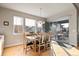 Dining area with wood floors and dining set features a sliding glass door to the patio at 7770 Owl Creek Cir, Littleton, CO 80125