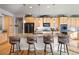 Spacious kitchen with a large island, granite countertops, stainless steel appliances, and pendant lighting at 7770 Owl Creek Cir, Littleton, CO 80125