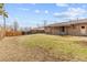 Expansive backyard with partial fencing, ideal for recreation and gardening at 1001 Dakin St, Denver, CO 80221