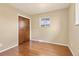 Bright bedroom with wooden floors and a closet, offering a cozy retreat at 1001 Dakin St, Denver, CO 80221