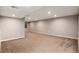 Bright basement space with neutral walls, carpeted floors, and recessed lighting at 5294 S Espana St, Centennial, CO 80015