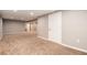 Open basement space, recently painted, with new carpet, and updated lighting at 5294 S Espana St, Centennial, CO 80015