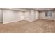 Spacious carpeted basement area with neutral paint and recessed lighting at 5294 S Espana St, Centennial, CO 80015