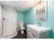 Stylish bathroom with glass shower, patterned tile accents, and modern vanity at 5294 S Espana St, Centennial, CO 80015