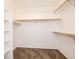 Walk in closet with carpet and wooden hanging bars at 5294 S Espana St, Centennial, CO 80015