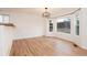 Bright dining room with hardwood floors and large bay windows at 5294 S Espana St, Centennial, CO 80015