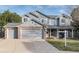 Charming two-story home featuring a brick and siding exterior, a well-maintained front yard, and an attached two-car garage at 5294 S Espana St, Centennial, CO 80015