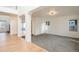 Open-concept living area featuring hardwood floors and seamless transitions between spaces at 5294 S Espana St, Centennial, CO 80015