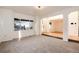 This living room offers carpeted floors and an open entryway at 5294 S Espana St, Centennial, CO 80015