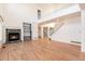 Spacious living room with a fireplace, built-in shelves, and staircase leading to the second floor at 5294 S Espana St, Centennial, CO 80015
