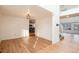 Open floor plan with hardwood floors, leading to kitchen and stairs at 5294 S Espana St, Centennial, CO 80015