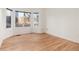 Bright living room with hardwood floors, bay windows, and neutral paint, perfect for a cozy and inviting space at 5294 S Espana St, Centennial, CO 80015