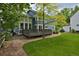 Well-maintained backyard with a spacious deck and mature trees at 2500 Lexington St, Lafayette, CO 80026