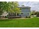 Spacious backyard with lush green grass and a charming deck perfect for relaxing at 2500 Lexington St, Lafayette, CO 80026