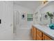 Bathroom features a double vanity, tub/shower combo, and neutral decor at 2500 Lexington St, Lafayette, CO 80026