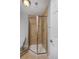 Bathroom featuring tile shower, glass door, and tile flooring at 2500 Lexington St, Lafayette, CO 80026