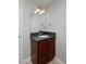 Cozy bathroom vanity featuring a granite top, wood cabinets, and modern fixtures at 2500 Lexington St, Lafayette, CO 80026