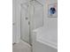 Bright bathroom showcases a shower with clear glass door and white tile surround at 2500 Lexington St, Lafayette, CO 80026