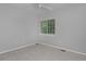 Bedroom showcasing neutral carpet, trim, baseboards, and a window with blinds at 2500 Lexington St, Lafayette, CO 80026