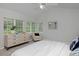 Bright bedroom features large windows, dresser, and cozy chair at 2500 Lexington St, Lafayette, CO 80026