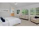 Spacious bedroom with large windows, dresser, and en-suite bathroom access at 2500 Lexington St, Lafayette, CO 80026