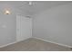 Bedroom with neutral carpet, large window, closet, and white baseboards at 2500 Lexington St, Lafayette, CO 80026