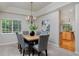 Formal dining room with a tray ceiling, chandelier, and carpet floors at 2500 Lexington St, Lafayette, CO 80026