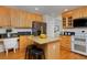 Bright kitchen featuring granite counters, stainless steel appliances, and center island at 2500 Lexington St, Lafayette, CO 80026