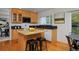 Functional kitchen featuring granite countertops, an island and wood cabinets at 2500 Lexington St, Lafayette, CO 80026