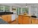 Well-lit kitchen with granite countertops, a breakfast island and adjacent dining area at 2500 Lexington St, Lafayette, CO 80026