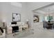 Open-concept living room and dining room boasts modern decor and ample natural light at 2500 Lexington St, Lafayette, CO 80026
