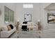 Bright living room showcasing a clear coffee table and comfortable seating arrangement at 2500 Lexington St, Lafayette, CO 80026