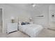 Well-lit main bedroom with neutral decor, stylish lamps, and comfortable bed at 2500 Lexington St, Lafayette, CO 80026