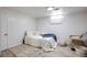 Finished basement bedroom with full-size bed and rug at 5986 S Cook St, Littleton, CO 80121