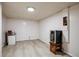 Finished basement with vinyl flooring and wine cooler at 5986 S Cook St, Littleton, CO 80121