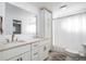 Modern bathroom with double vanity and a shower/tub combo at 5986 S Cook St, Littleton, CO 80121