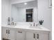 Modern bathroom with double vanity and updated fixtures at 5986 S Cook St, Littleton, CO 80121