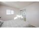 Well-lit bedroom featuring a queen bed and mirrored closet doors at 5986 S Cook St, Littleton, CO 80121