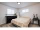 Bedroom with a queen bed, dresser, and nightstand at 5986 S Cook St, Littleton, CO 80121