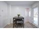 Small dining area with table and four chairs near kitchen at 5986 S Cook St, Littleton, CO 80121