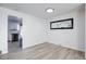 Simple dining area with hardwood floors and view into kitchen at 5986 S Cook St, Littleton, CO 80121