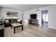 Bright living room featuring hardwood floors and a modern aesthetic at 5986 S Cook St, Littleton, CO 80121