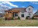 Beautiful backyard featuring a patio area and a lush lawn at 7084 Moss Ct, Arvada, CO 80007