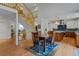 Open floor plan featuring a dining area adjacent to the kitchen and a staircase at 7084 Moss Ct, Arvada, CO 80007