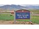 Sign for West Arvada Dog Park in Arvada, a perfect place to bring your canine companion at 7084 Moss Ct, Arvada, CO 80007