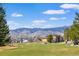 Stunning mountain views from this home overlooking a lush green golf course at 7084 Moss Ct, Arvada, CO 80007